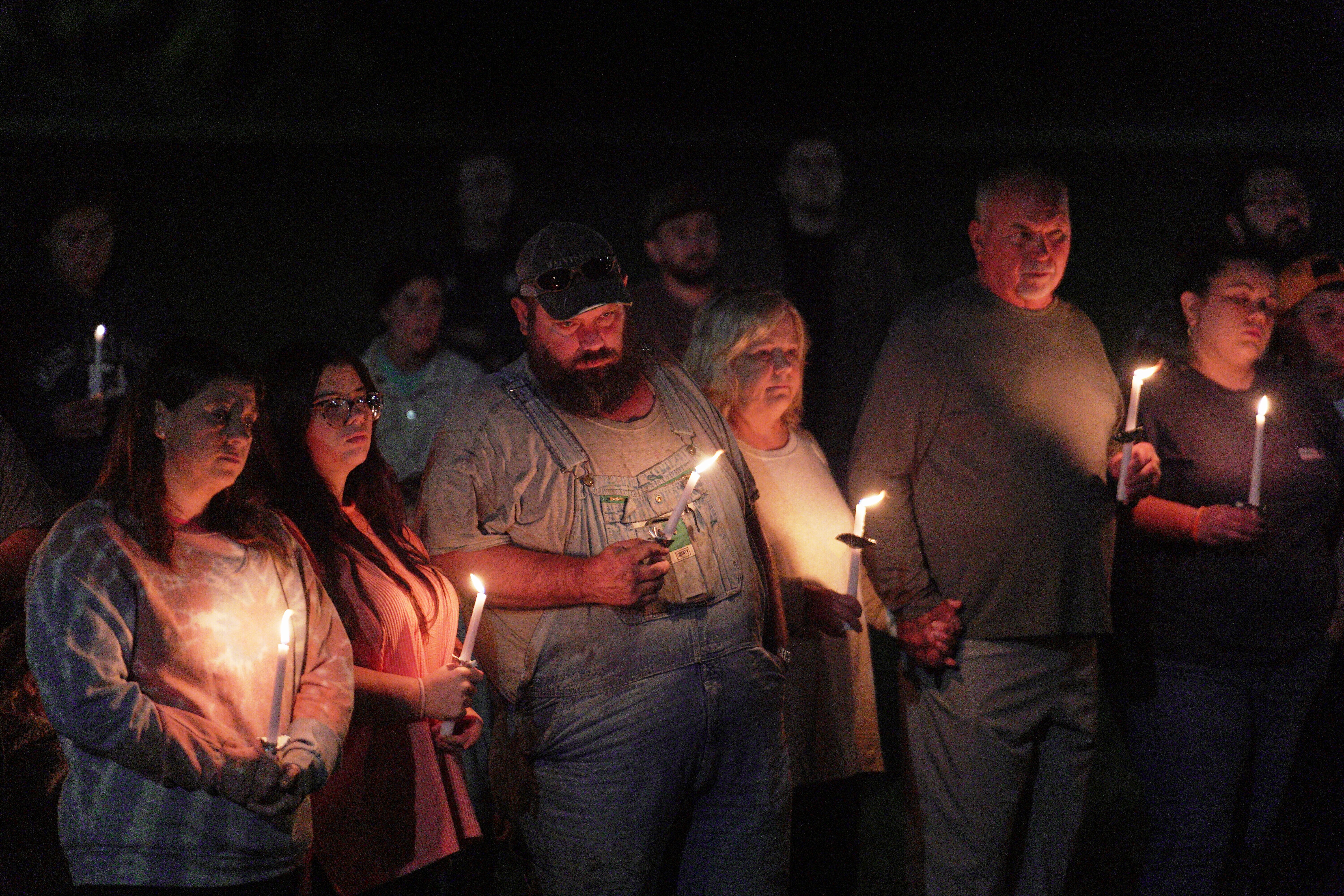 Residents attend a vigil honoring the victims of a blast at an explosives plant, Accurate Energetic Systems, on Friday, Oct. 10, 2025, in Centerville Tenn.
